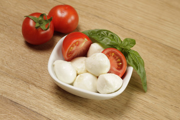 Mozzarella with basil and tomatoes