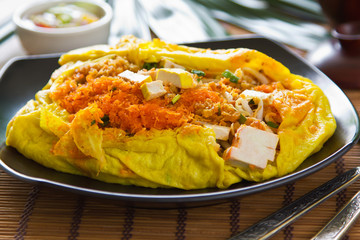 Stir fried  wrapped in omelete [Thai 's food]
