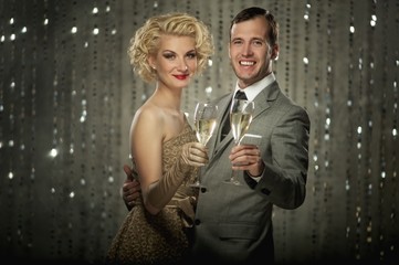 Retro couple with glasses of champagne