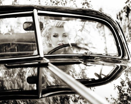 Retro Woman Behind Steering Wheel