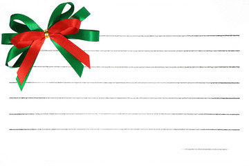 Colorful bow on notepaper