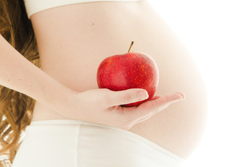 pregnant woman with red apple 