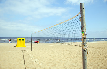 Volleyball net sea waste bin boat people relax