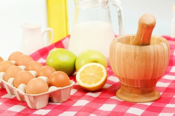 Milk in a glass jar and eggs