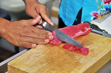 Chef cutting Tuna fish