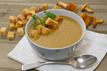Chanterelle soup puree served with croutons