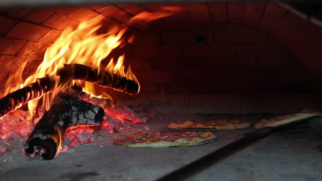 Pizza Baking in Wood Fired Oven
