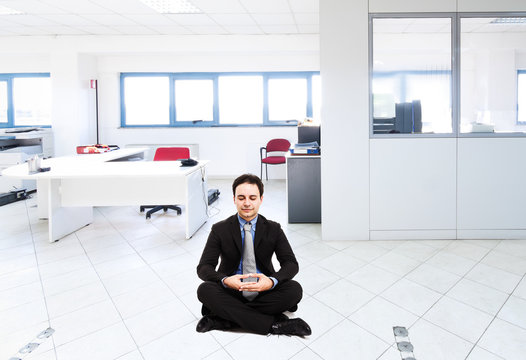 Businessman in a meditation pose