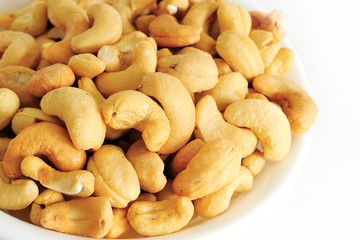 A Bowl of Cashew Nuts on White background