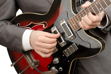 Young guitar player isolated on white