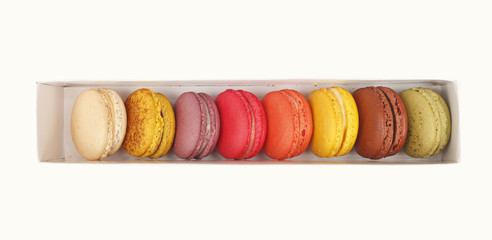 Macarons in white box isolated white background
