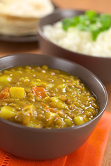 Bowl of spicy Indian dal (lentil) curry with carrot, potato