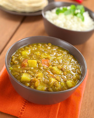 Bowl of spicy Indian dal (lentil) curry with carrot and potato