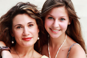 Mother and teenage daughter outside