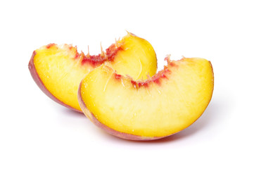 Fototapeta na wymiar slices of peach on white background