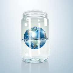 Planet earth inside glass jar