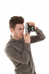Fototapeta premium Young adult male with olf film camera