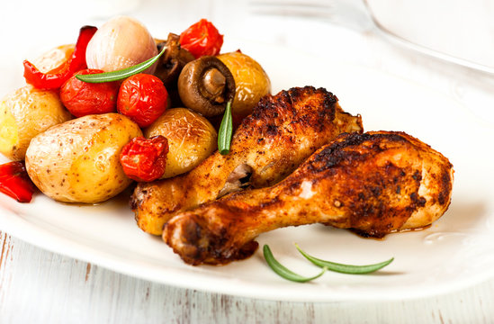 Roasted chicken with oven baked vegetables and mushrooms