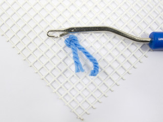 Latch Hook Rug stitch with canvas and yarn