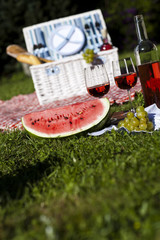 Picnic basket with fruit bread and wine