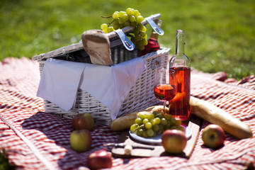 Picnic basket with fruit bread and wine