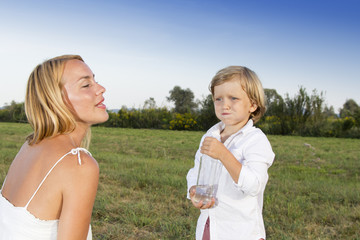 Young boy with his mother outdoors