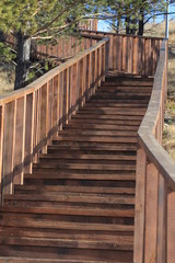 Fototapeta na wymiar Drewniane schody z poręczami