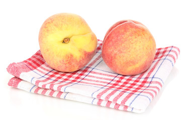 ripe peaches on napkin isolated on white.