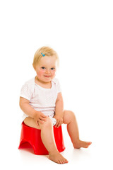 Toddler girl potty trainting isolated on white - obrazy, fototapety, plakaty