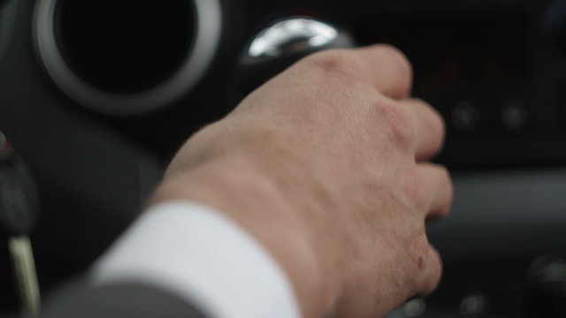Close up of hand on manual gear shift knob