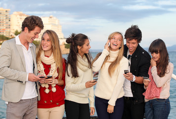 teens with mobile or cell phones