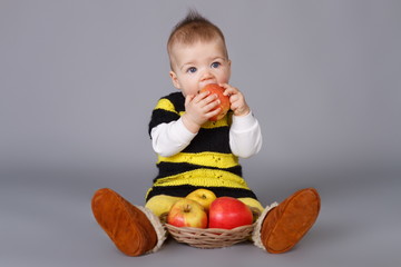 Little baby with apples