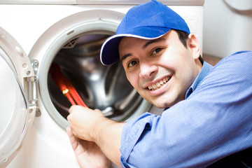 Technician repairing a washing machine