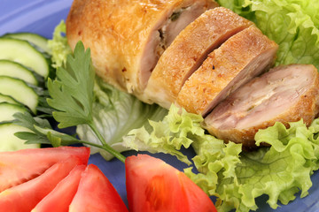 Tasty meat cutlet with garnish on plate close-up