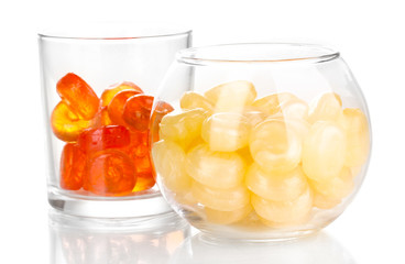 Color candies in glasses isolated on white