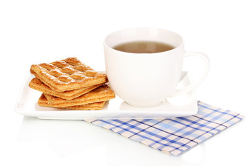Cup of tea and cookies isolated on white