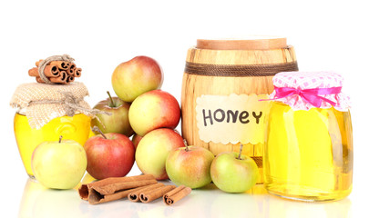 Honey and apples with cinnamon isolated on white