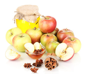 Honey and apples with cinnamon isolated on white