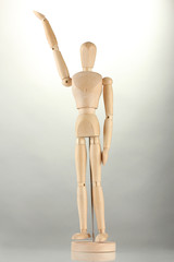 wooden mannequin, on grey background