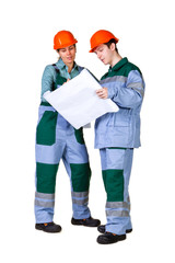 Isolated picture of young construction workers with blueprint