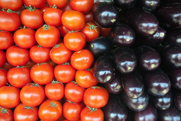 Red tomatoes and black aubergine