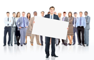 Fototapeta premium Business man with a banner and his business team