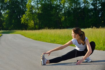 Fototapeta na wymiar woman stretching before fitness