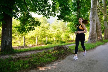 Fototapeta na wymiar Young beautiful woman jogging