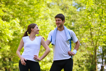 Couple doing stretching exercise  after jogging