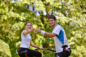 Fototapeta premium Happy couple ridine bicycle outdoors
