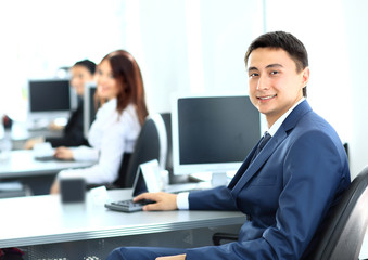 Portrait of a smiling young businessman working