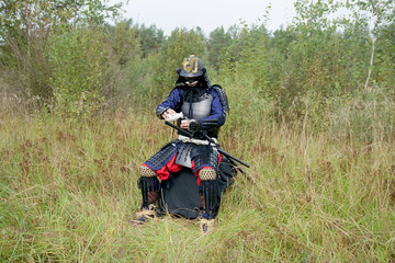Samurai pours himself sake