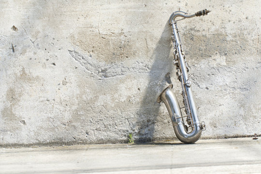sax in front of a vintage wall