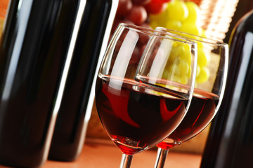 Composition with two glasses and bottles of wine